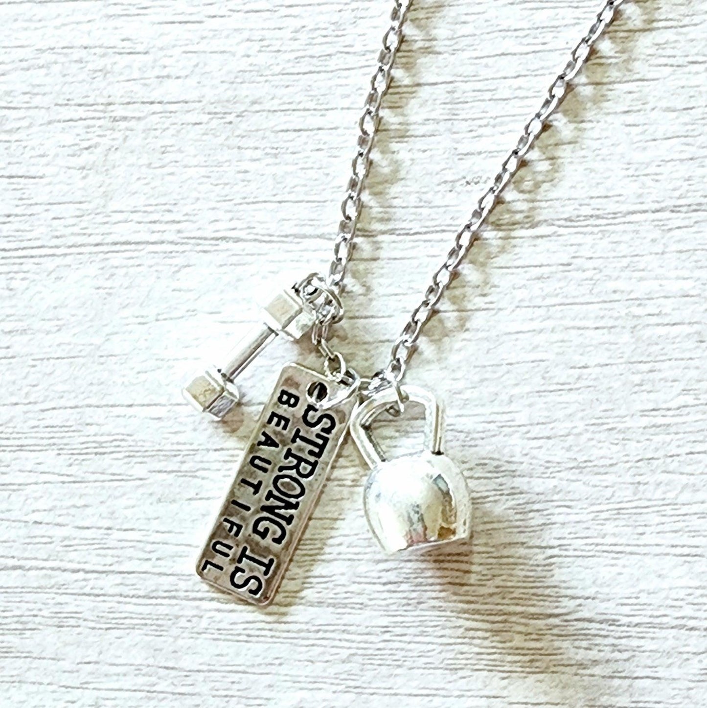 'Strong is Beautiful' charm necklace with dumbbell - the perfect gift for fit girls!